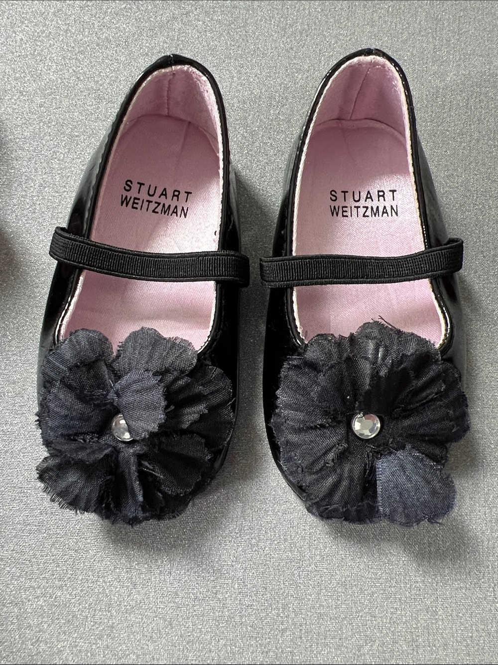 Stuart Weitzman Black Patent Mary Jane Shoes with Flower Accent